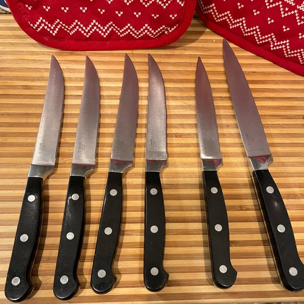 Set of Six Black Handle Wolfgang Puck Steak Knives